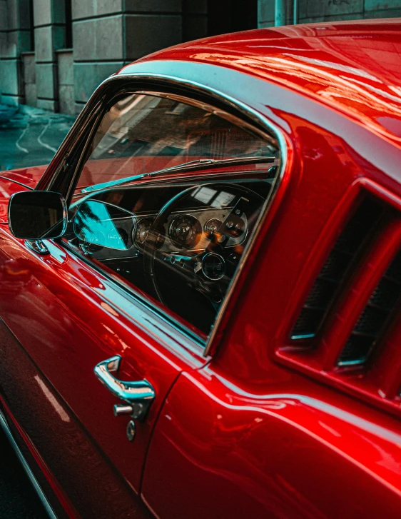 a red car parked on the side of the road, by Adam Marczyński, pexels contest winner, photorealism, mustang, inside of a car, profile image, multiple stories