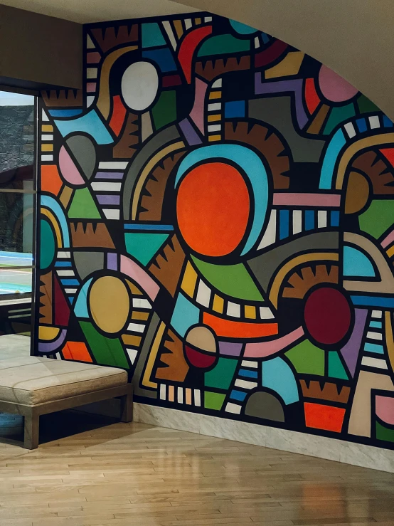 a room with a large painting on the wall, inspired by Alexander Archipenko, trending on unsplash, beautiful colorful tilework, vista view, wall mural, detailed color scan