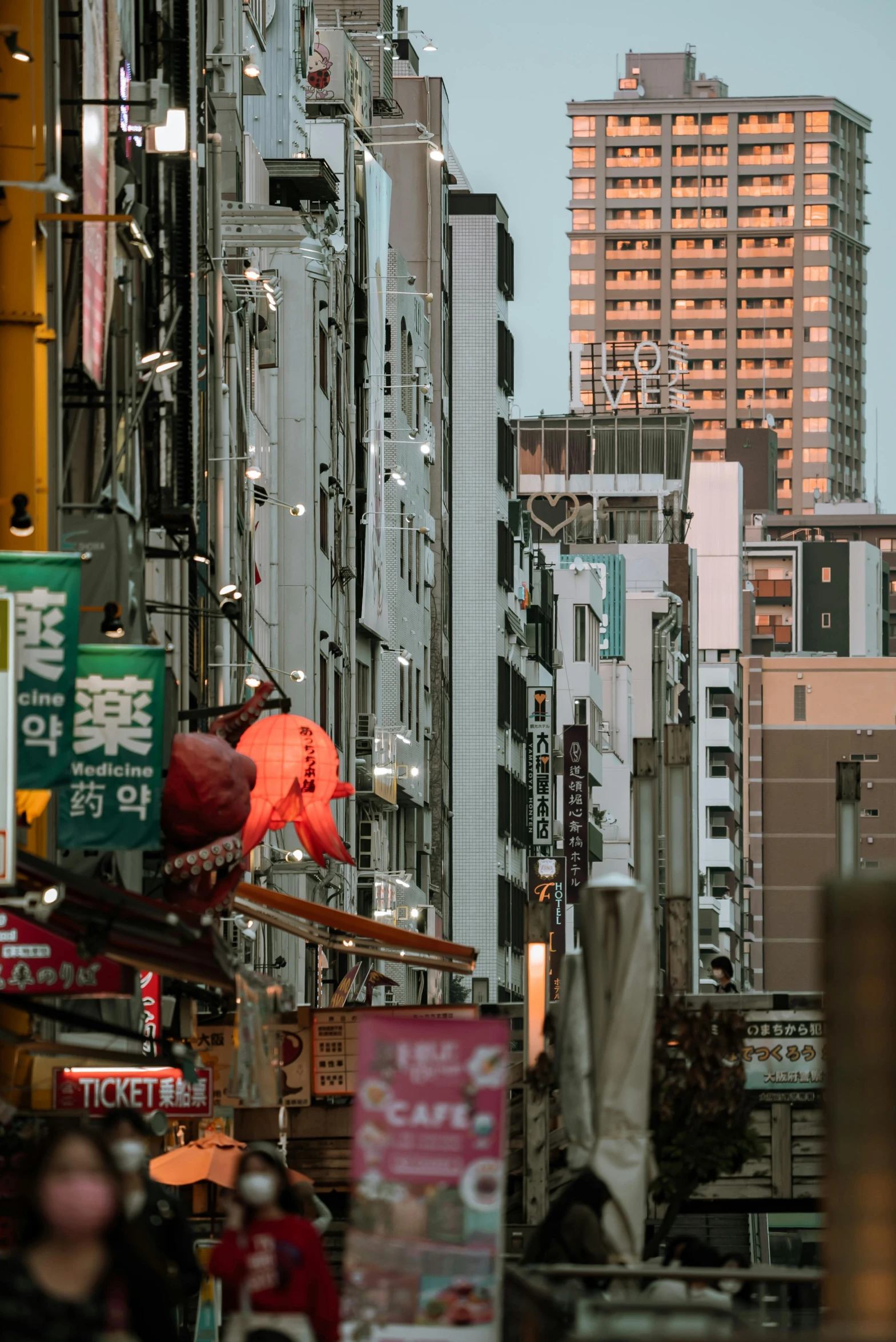 a city street filled with lots of tall buildings, inspired by Kanō Hōgai, unsplash contest winner, colorful signs, ethnicity : japanese, brutalist city, early evening