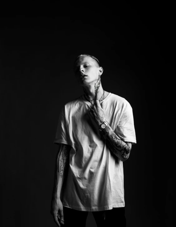 a black and white photo of a man with tattoos, unsplash, minimalism, die antwoord yolandi visser, pete davidson, dressed in a white t shirt, large)}]