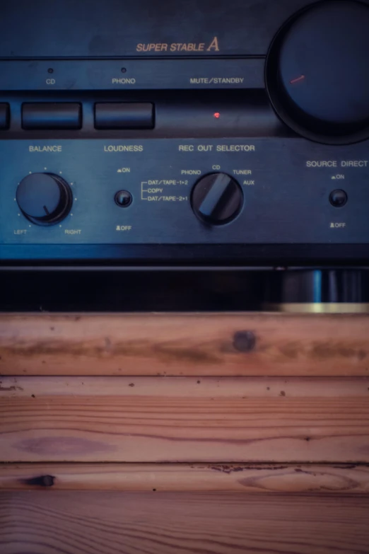 a radio sitting on top of a wooden table, an album cover, by Niko Henrichon, unsplash, precisionism, oven, synthesizers, detail shot, 1990's photo