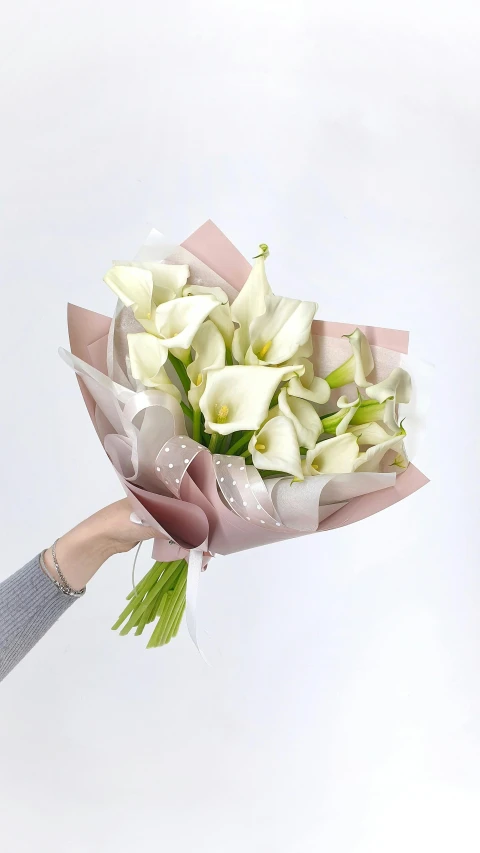 a woman holding a bouquet of white flowers, inspired by Carpoforo Tencalla, trending on unsplash, glossy white, glittering and soft, ribbon, full product shot