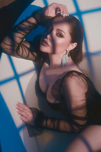 a woman in a black dress posing for a picture, an album cover, inspired by Gina Pellón, instagram, aishwarya rai, soft luminescent glow, “diamonds, official store photo