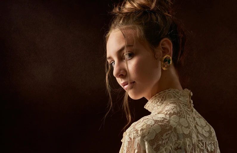 a close up of a person wearing a dress, a character portrait, inspired by Elsa Bleda, trending on pexels, renaissance, studio!! portrait lighting, golden earrings, teenager girl, ornate portrait