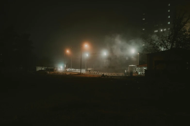 a black and white photo of a park at night, by Adam Marczyński, pexels contest winner, happening, police sirens in smoke, dark building, colored fog, dark dirty grungy streets