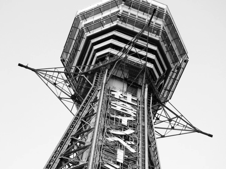 a black and white photo of a tall tower, an album cover, by Thomas Häfner, hurufiyya, the space needle, high technical detail, octa 8k, a huge radar