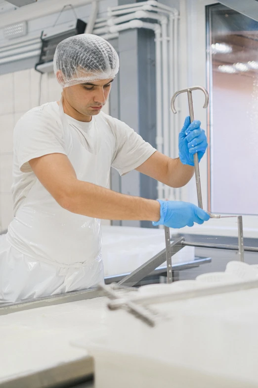 a man in a white shirt and blue gloves, a silk screen, shutterstock, holding a thick staff, cryogenic pods, top production, ready to eat