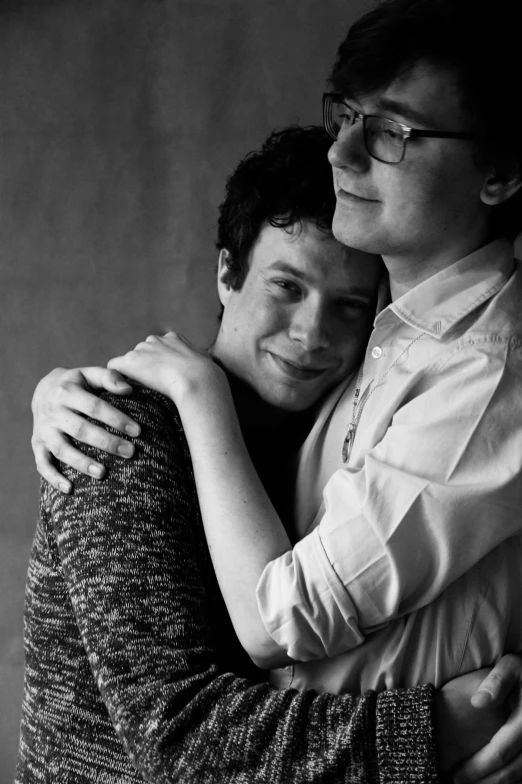 a black and white photo of a man hugging a woman, a black and white photo, by Felix-Kelly, joe keery, homestuck, ben folds portrait, ((portrait))