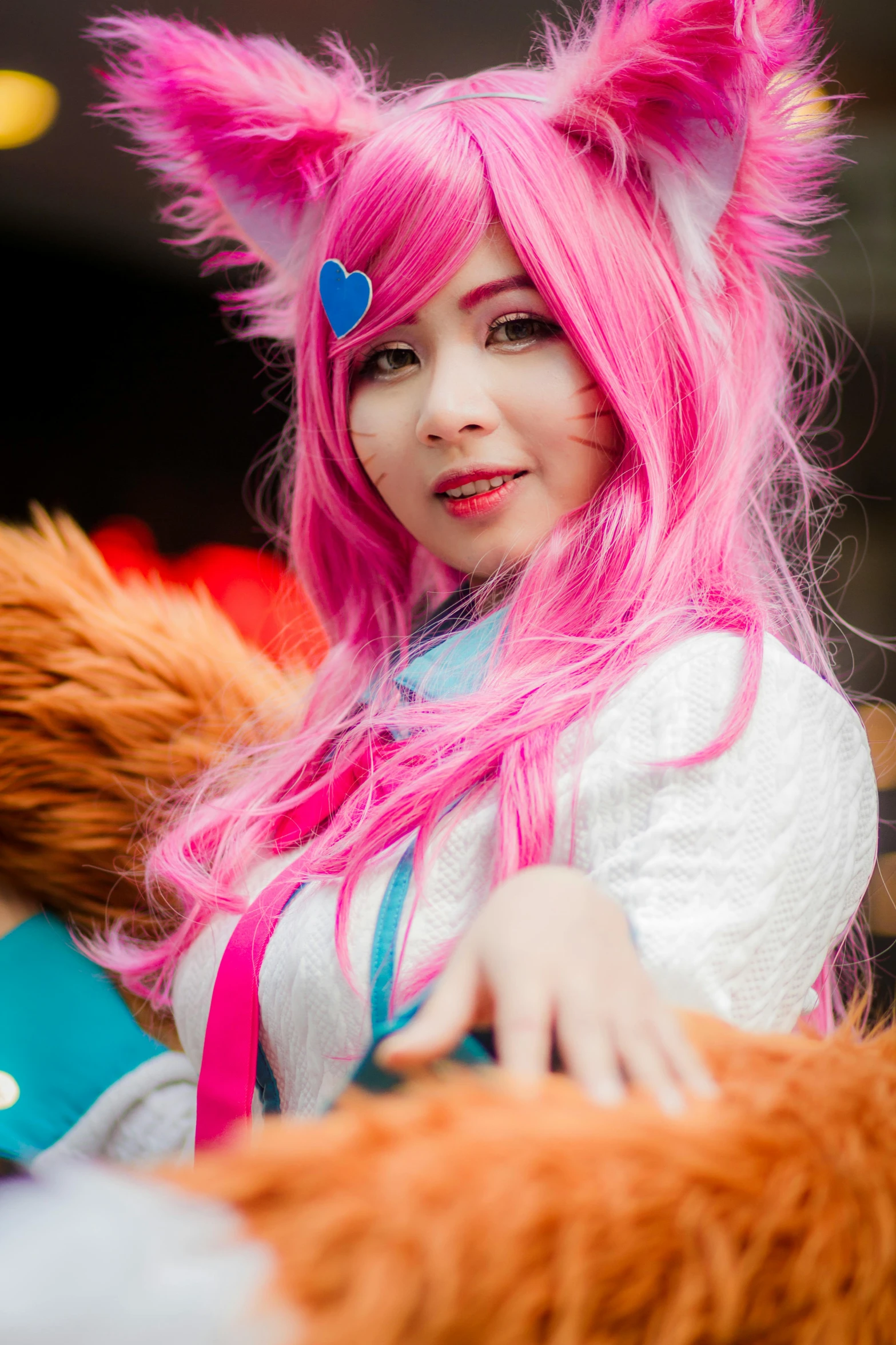 a woman with pink hair holding a teddy bear, inspired by Hirosada II, reddit, closeup photo at nyc comicon, portrait of ahri, ((pink)), pink white turquoise