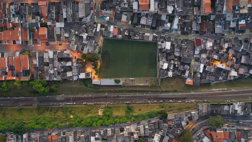 an aerial view of a city with lots of buildings, an album cover, by Daniel Lieske, unsplash contest winner, soccer, brazilian, township, dezeen