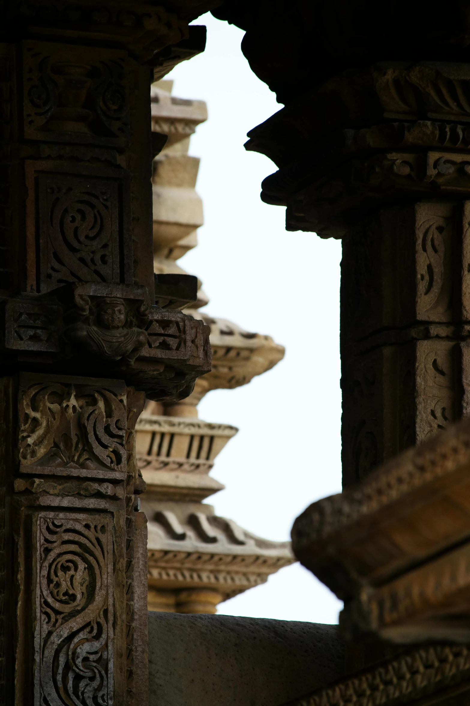 a couple of pillars sitting next to each other, intricate details in the frames, shaved temple, up-close, shot from a distance