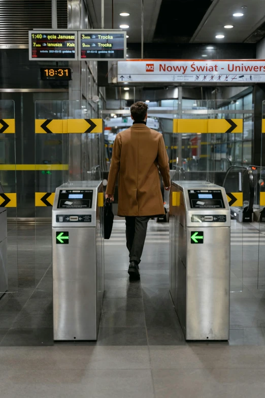 a man standing in front of three turns at a subway station, happening, warsaw, gate, holodeck, thumbnail