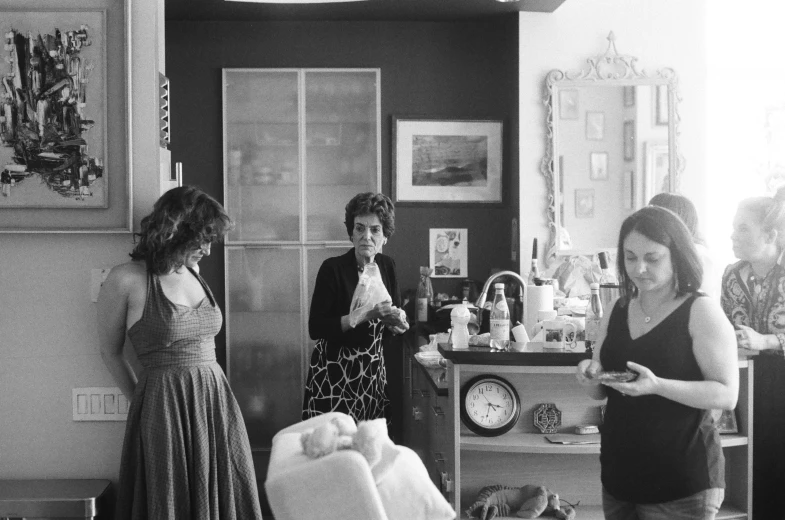 a group of women standing in a living room, a black and white photo, process art, three cats drinking in a bar, pregnancy, medium format photography, :: morning