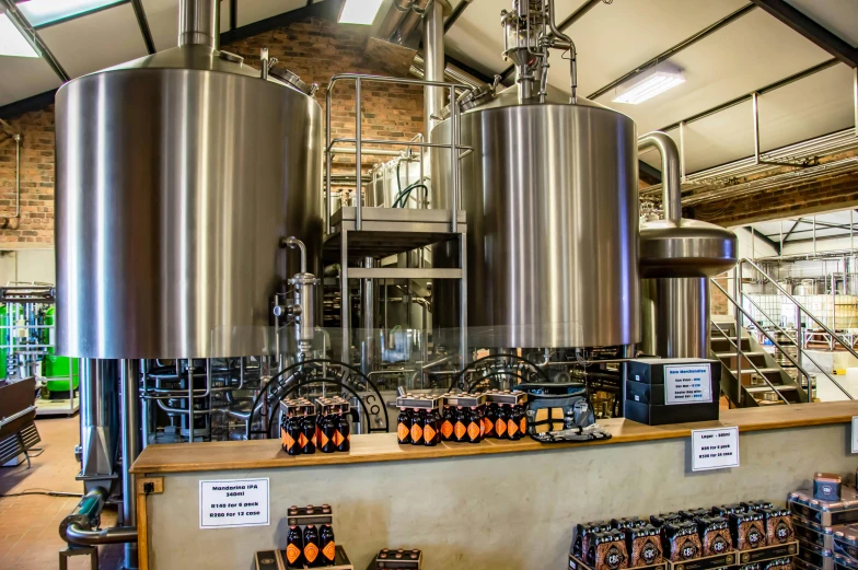 a bunch of tanks that are inside of a building, by Steve Prescott, unsplash, beer, stainless steel, caramel, panorama shot