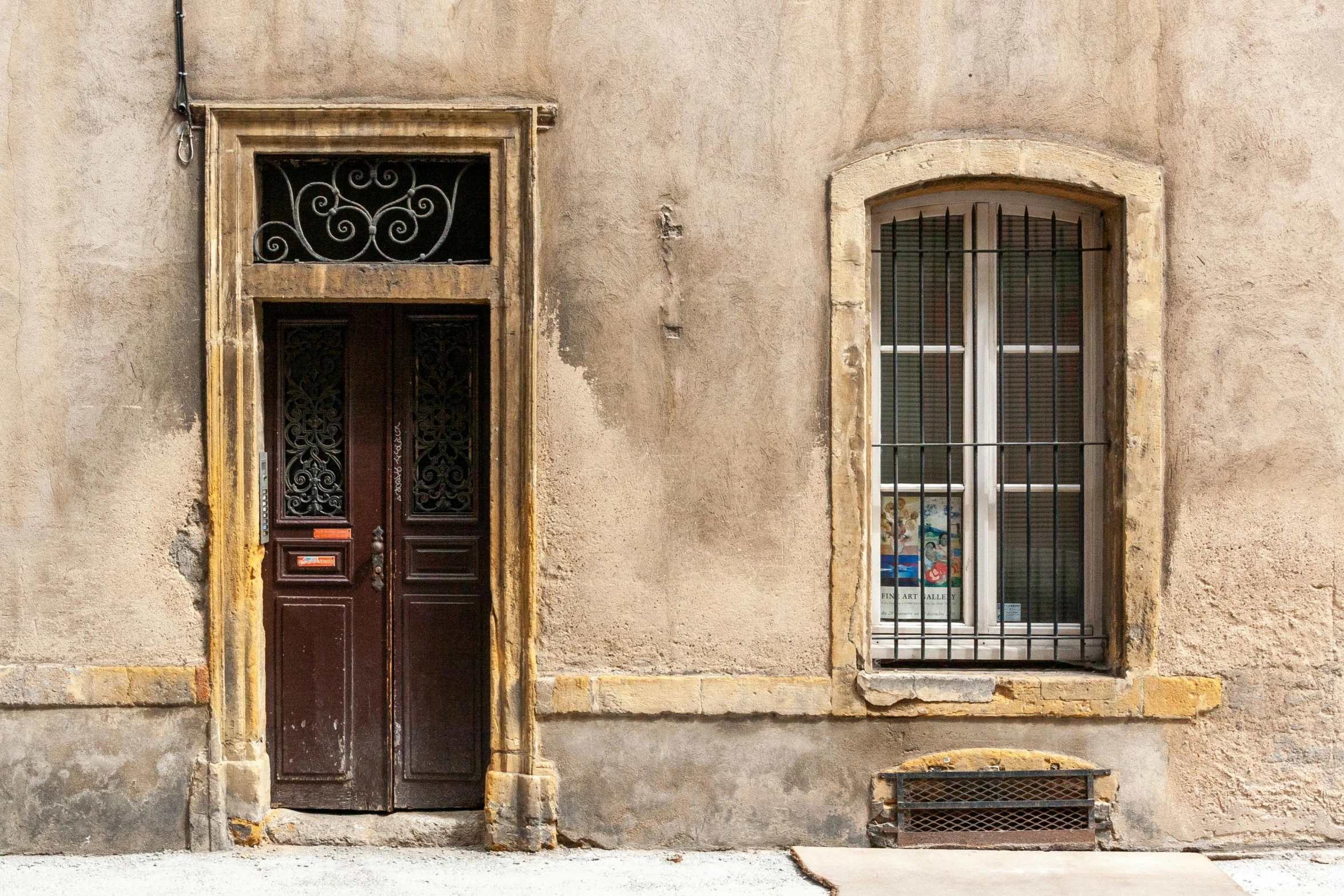 a red fire hydrant sitting in front of a building, a photo, by Daniel Gelon, pexels contest winner, romanesque, french door window, taupe, shady alleys, antoni tapies and cy twombly