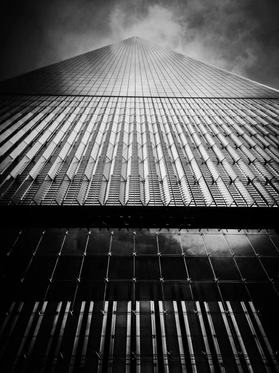 a black and white photo of a tall building, by Andrew Domachowski, full of glass. cgsociety, holga 120n, unsplash contest winning photo, world trade center twin towers