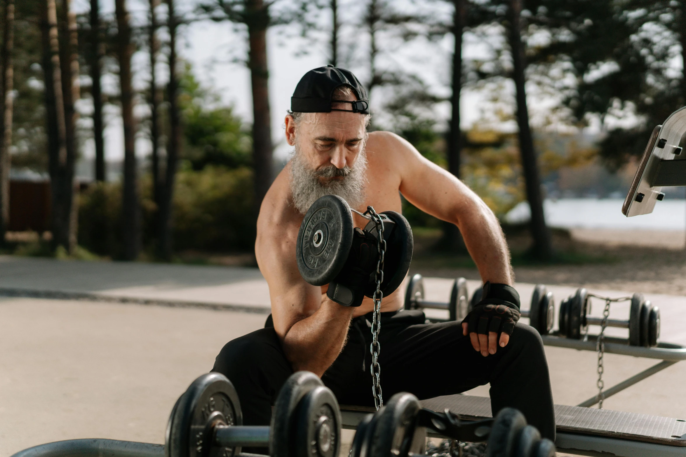 a man sitting on a bench with a barbell in his hand, pexels contest winner, bushy white beard, 6 pack, pistons and bolts, avatar image