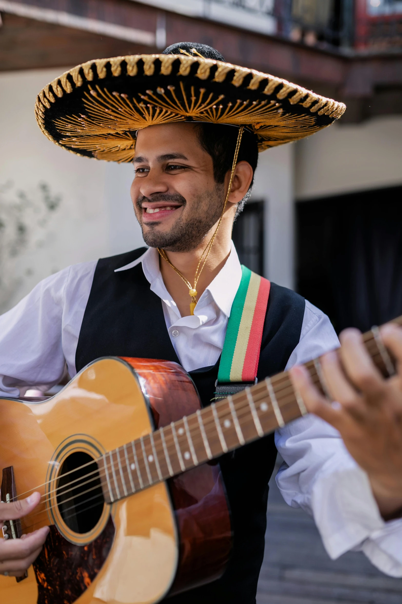 a man in a sombrena playing a guitar, an album cover, inspired by Germán Londoño, pexels contest winner, wearing authentic attire, while smiling for a photograph, mexican, ( ( theatrical ) )