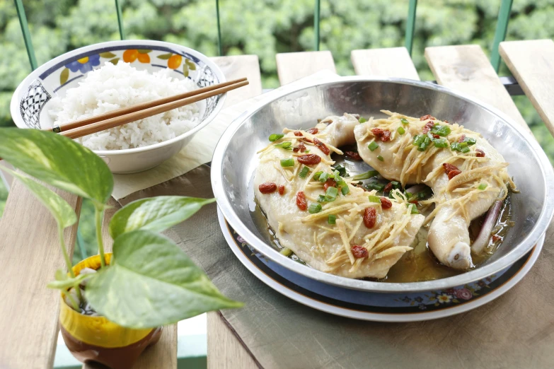 a plate of food sitting on top of a wooden table, inspired by Cui Bai, swirling silver fish, cheongsam, a blond, nature outside