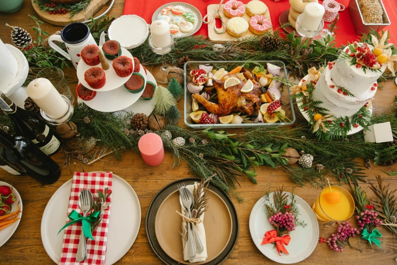 a wooden table topped with plates of food, by Carey Morris, pexels, decorated ornaments, evergreen branches, full body image, 🦩🪐🐞👩🏻🦳
