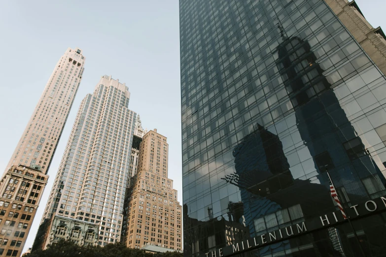 a couple of tall buildings sitting next to each other, a picture, by William Berra, unsplash contest winner, modernism, with shiny glass buildings, usa-sep 20, 2000s photo