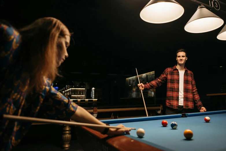 a man and a woman playing a game of pool, pexels contest winner, charli bowater and artgeem, lit from behind, lachlan bailey, center of image