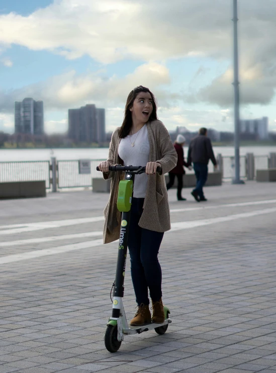 a woman riding a scooter on a sidewalk, happening, nvidia promotional image, on liberty island, profile picture, epic award winning