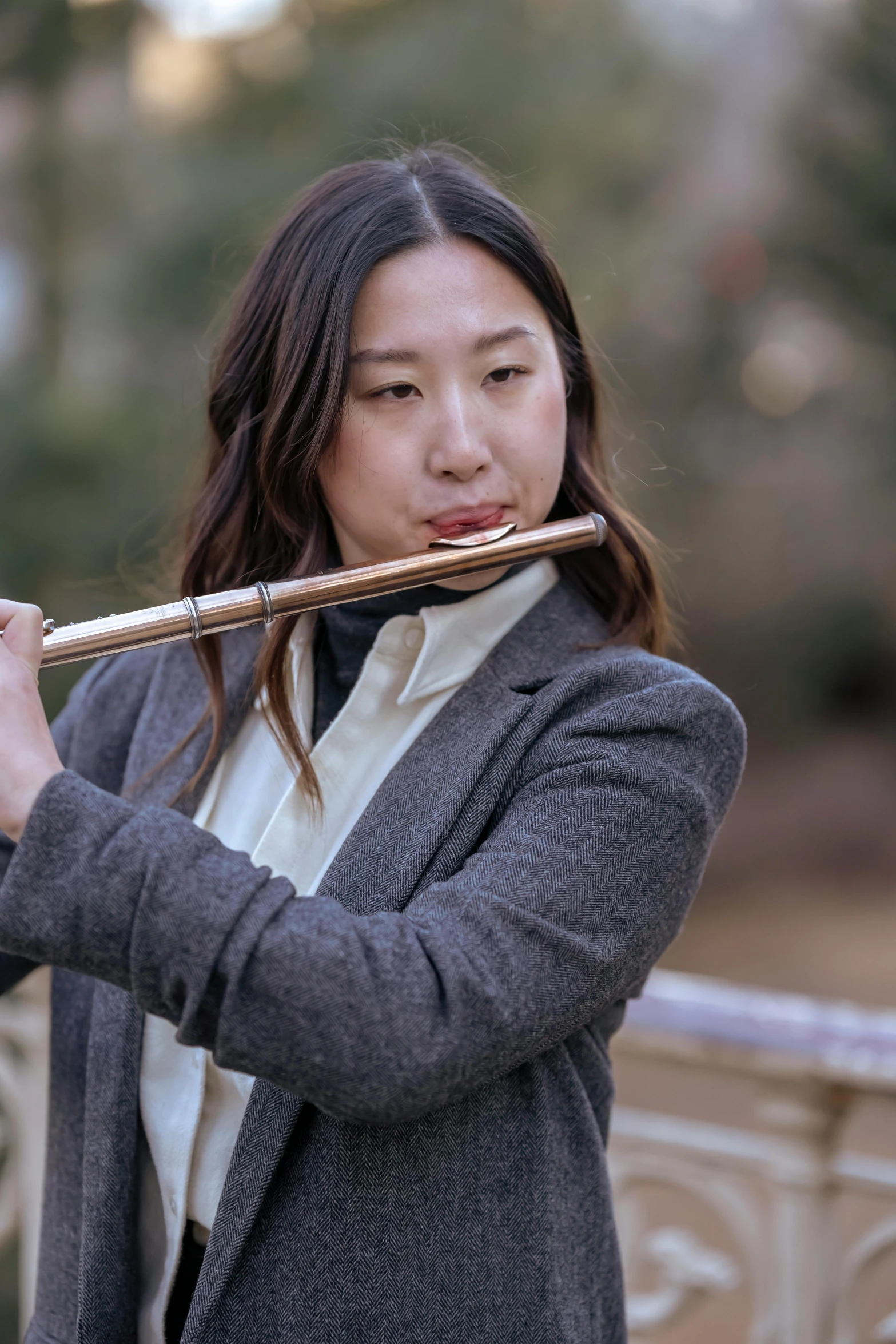 a woman playing a flute on a bridge, inspired by Miyagawa Chōshun, unsplash, baroque, yanjun chengt, rectangle, brown, band