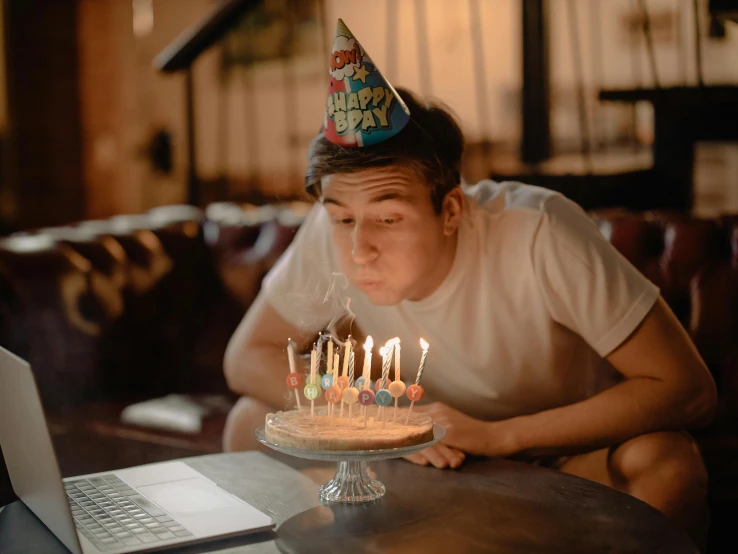 a man blowing out candles on a birthday cake, pexels contest winner, hyperrealism, 18 years old, asian male, dunce, youtube thumbnail
