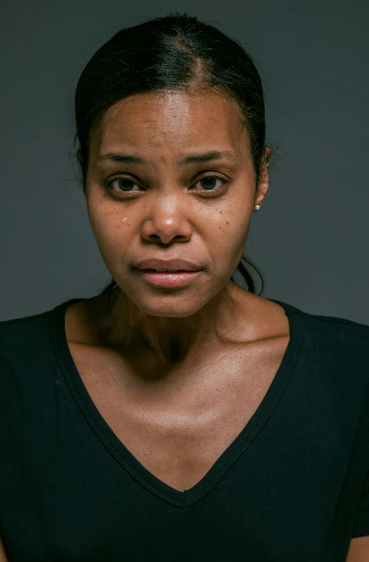 a woman with a concerned look on her face, alexis franklin, lightly dirty face, spotlight in middle of face, body and headshot