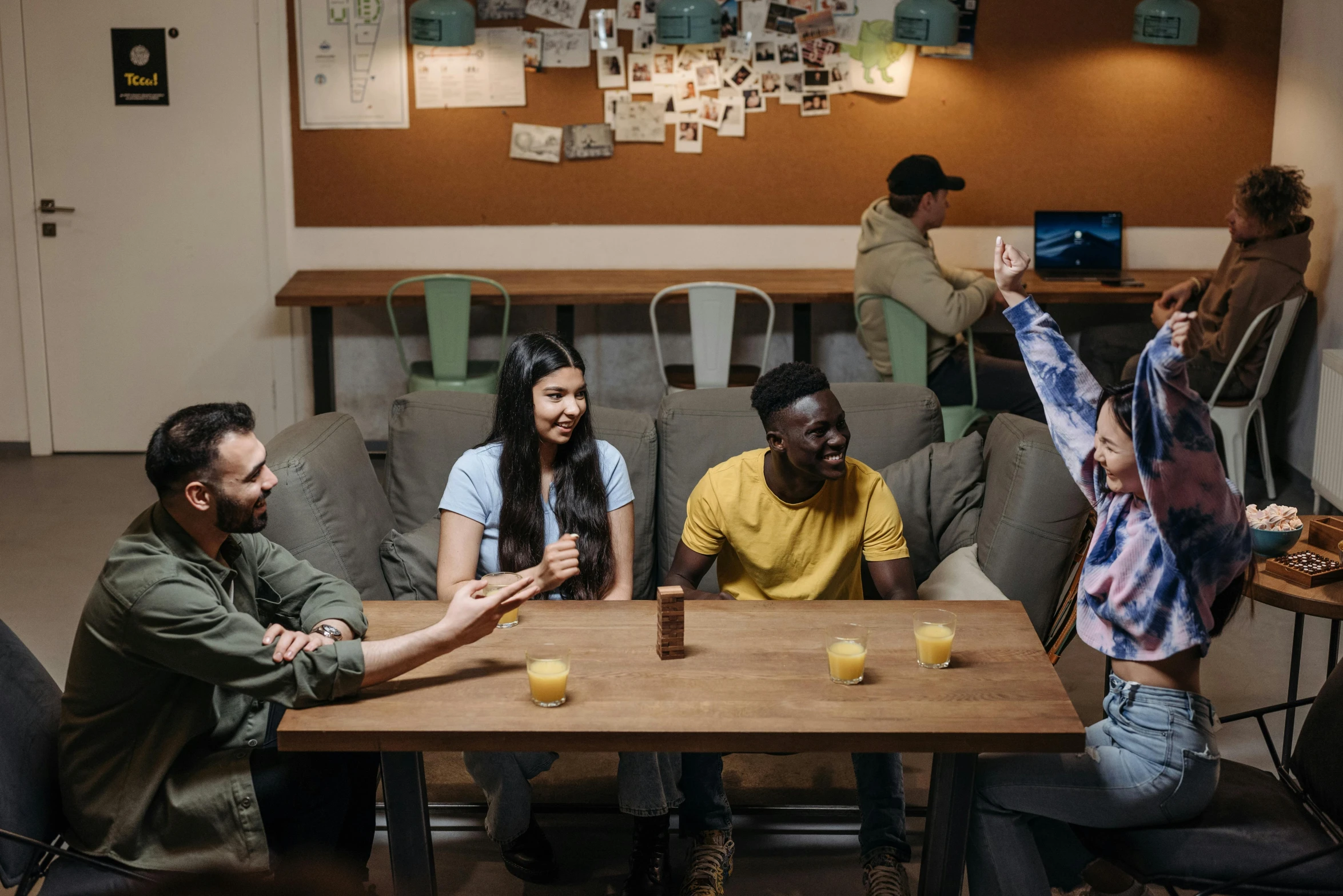 a group of people sitting around a wooden table, avatar image, aussie baristas, teenager hangout spot, thumbnail