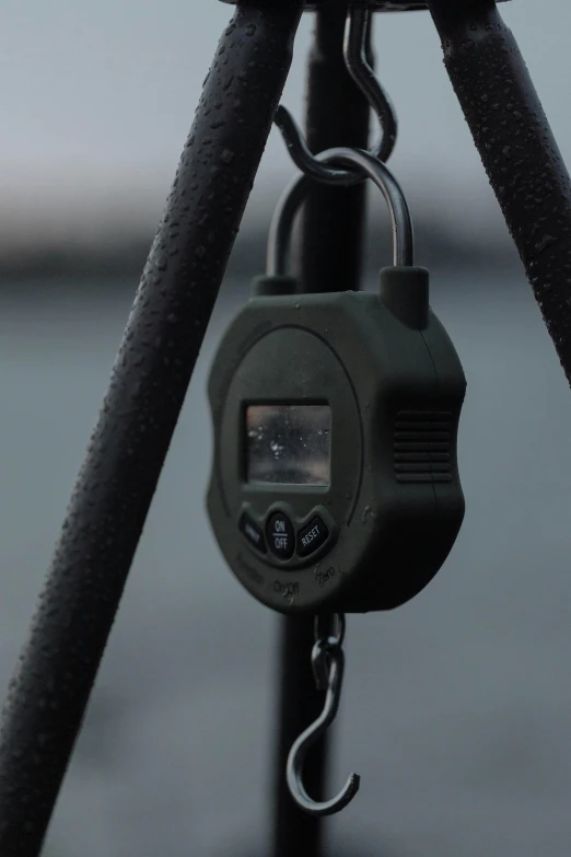 a close up of a camera on a tripod, lock, hanging, dark dingy, shot with hasselblade camera