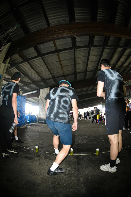 a group of men standing next to each other on skateboards, graffiti, photographed from the back, mocap, rave otufit, te pae