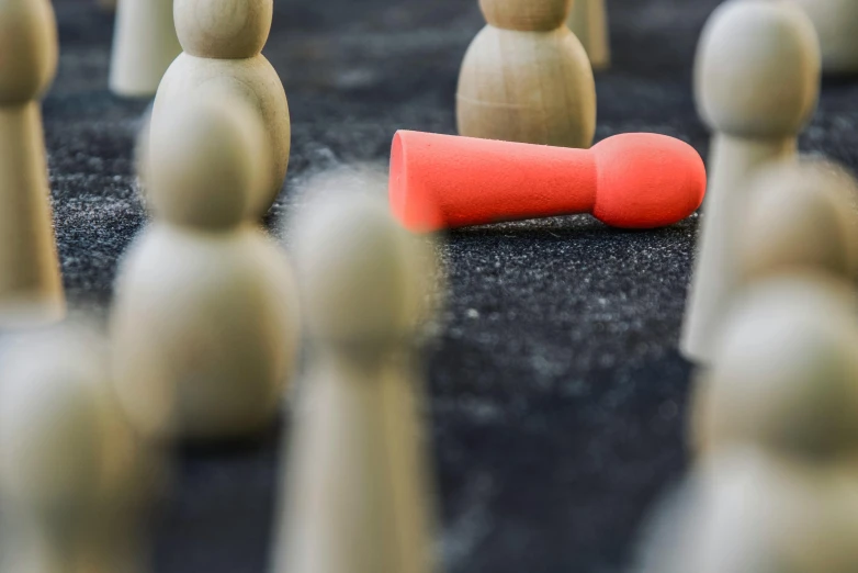 a group of wooden people standing next to each other, by Julian Allen, pexels contest winner, red and grey only, cone, standoff, tournament