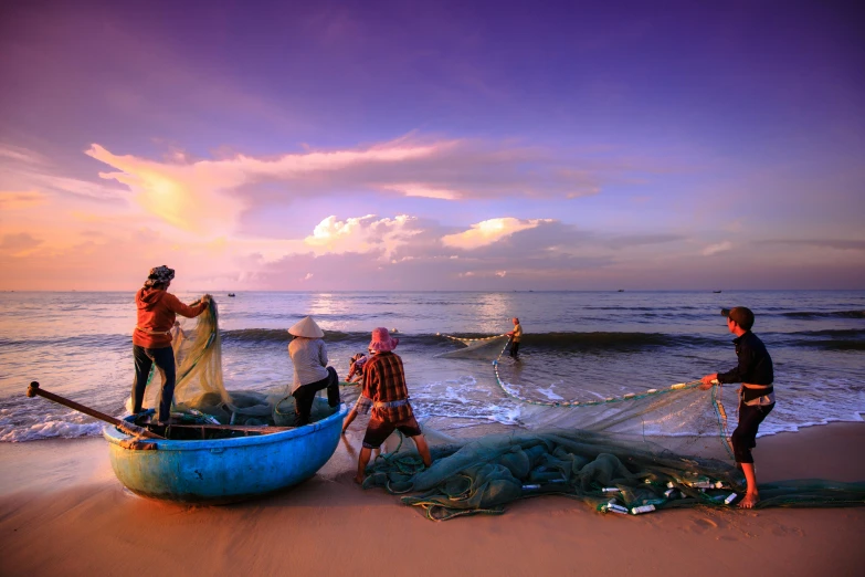 a group of people standing on top of a beach next to the ocean, inspired by Steve McCurry, pexels contest winner, fishing boats, netting, thumbnail, vietnam