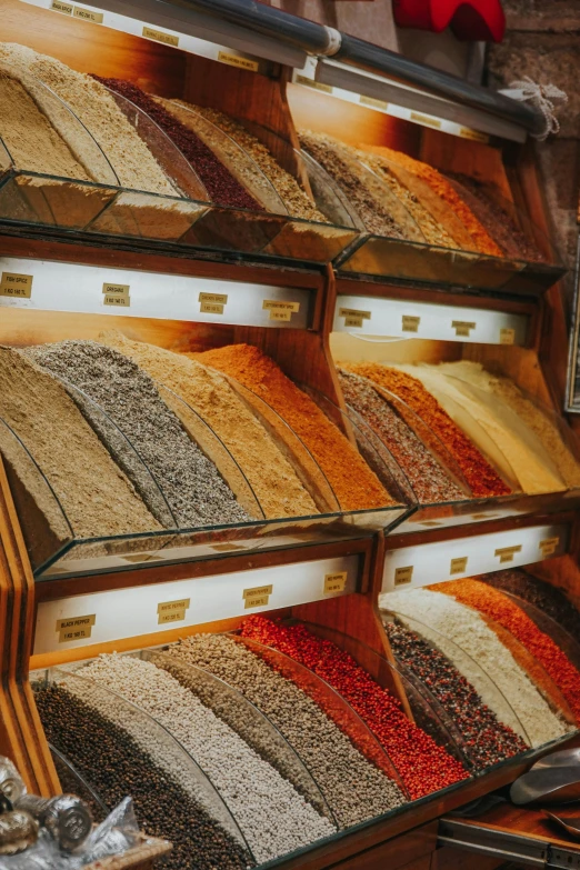 a display case filled with lots of different types of spices, trending on pexels, renaissance, 2 5 6 x 2 5 6 pixels, urban surroundings, on ship, sequins