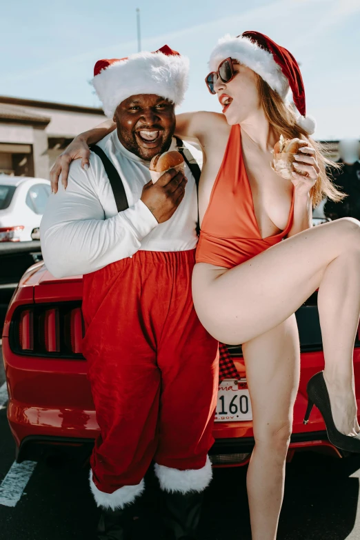 a man and a woman posing in front of a car, foodporn, red jumpsuit, huell babineaux, white girl