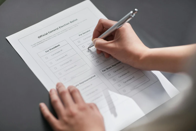 a person writing on a piece of paper with a pen, presidental elections candidates, ignant, avatar image, royal commission