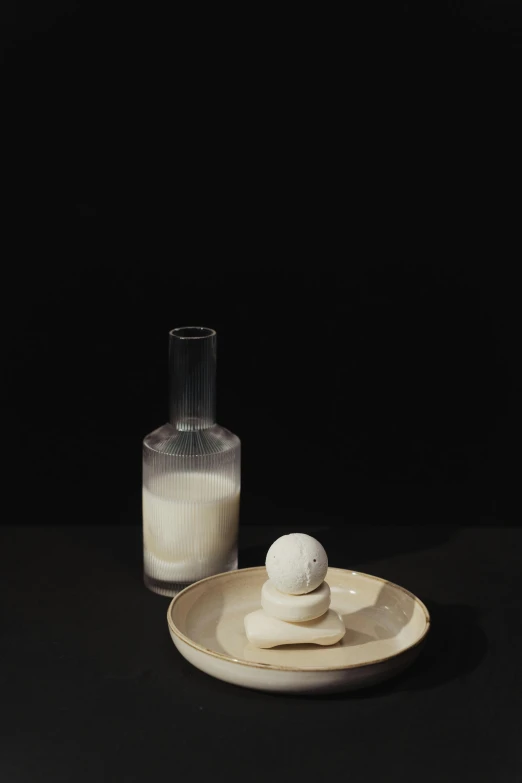 a dessert sitting on a plate next to a glass of milk, a marble sculpture, by Alison Geissler, purism, - 9, marshmallow, bao pham, ignant