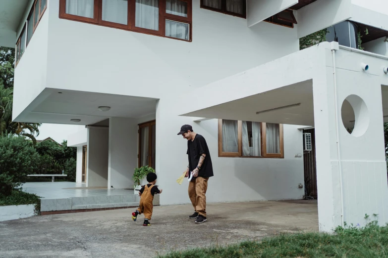 a man and a child walking in front of a house, pexels contest winner, minimalism, skateboarder style, yung lean, thawan duchanee, playing