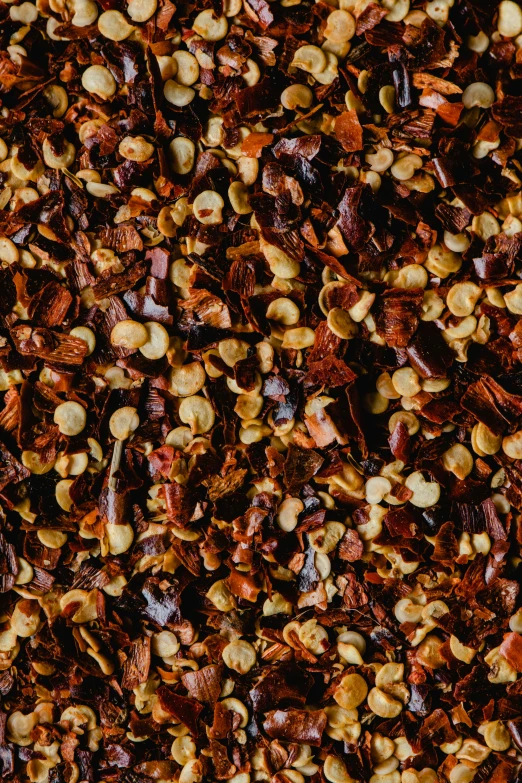 a close up of a mixture of nuts and seeds, by Julia Pishtar, carolina reaper, flattened, full width, dark orange