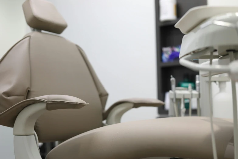 a close up of a chair in a dentist's office, lachlan bailey, zenra taliyah, zoomed out shot, brown