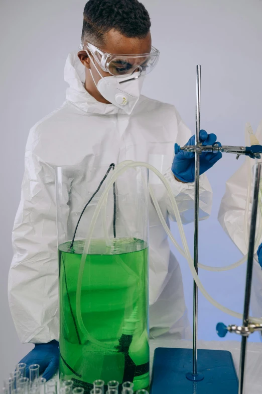 a couple of men standing next to each other, shutterstock, process art, beautiful green liquid, scientific equipment, fluid bag, gif