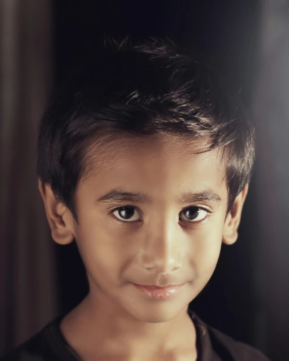 a young boy is posing for a picture, a character portrait, pexels contest winner, hurufiyya, non binary model, jayison devadas, huge adorable eyes, taken in the late 2010s