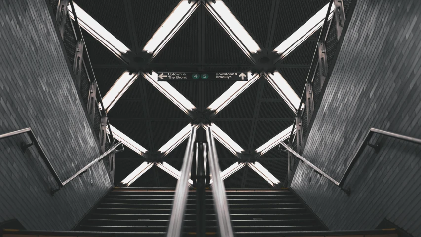 a black and white photo of an escalator, an album cover, pexels contest winner, light and space, square lines, unsplash 4k, black. airports, perfectly symmetrical