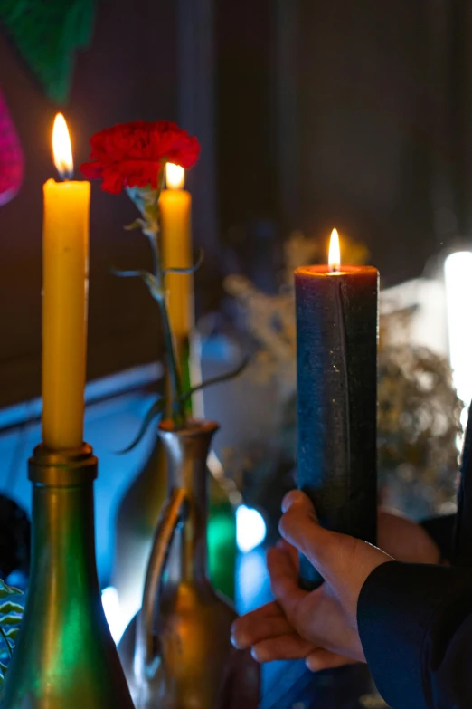 a close up of a person holding a candle, tall, decorations, critical role, uplit