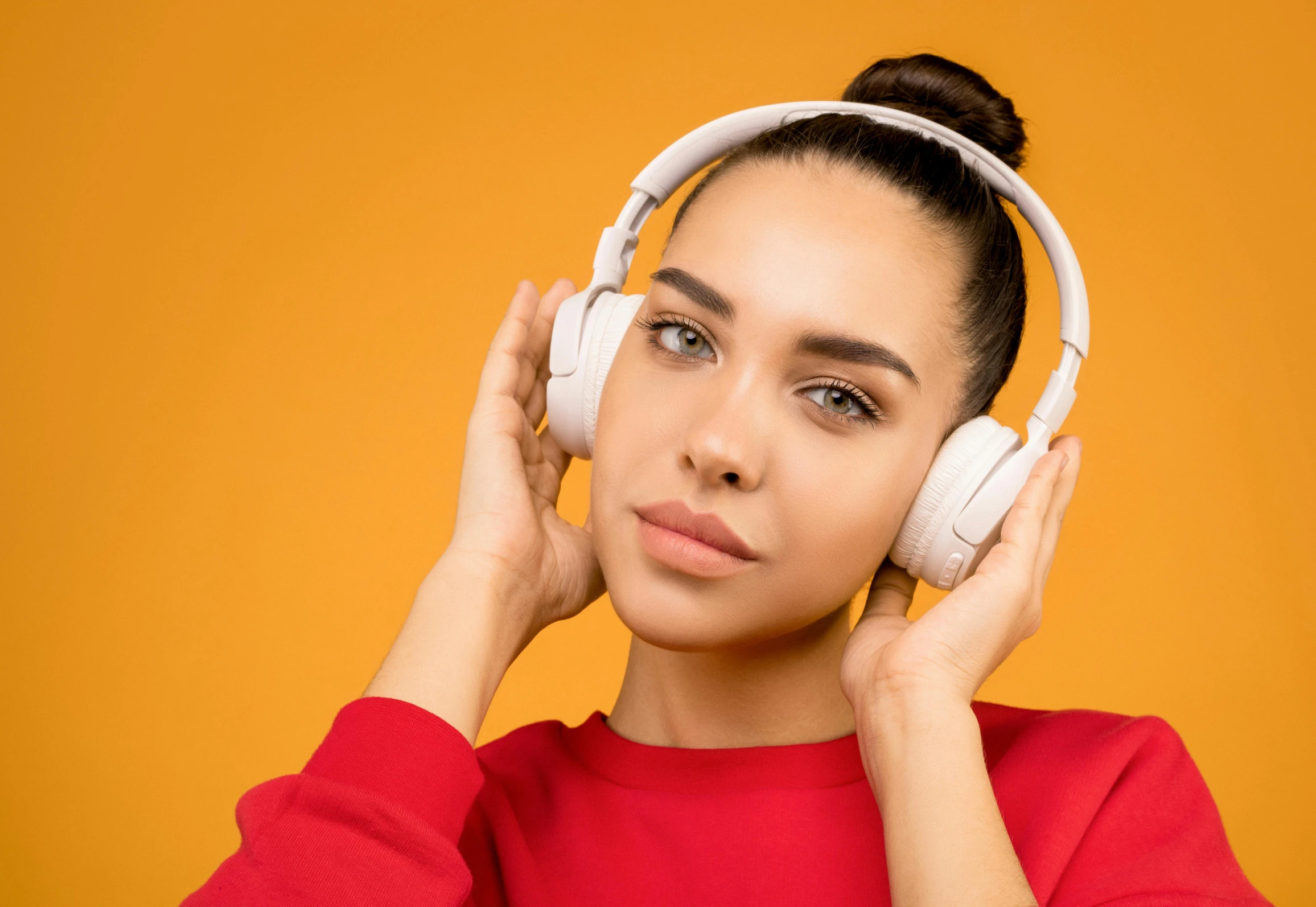 a woman listening to music with headphones, trending on pexels, aestheticism, orange halo around her head, pointy ears, thumbnail, red headphones