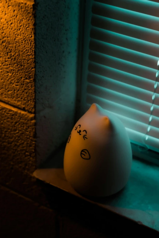 a white egg sitting on top of a window sill, inspired by Elsa Bleda, mingei, adorable glowing creature, snorlax, 8k 50mm iso 10, squishy