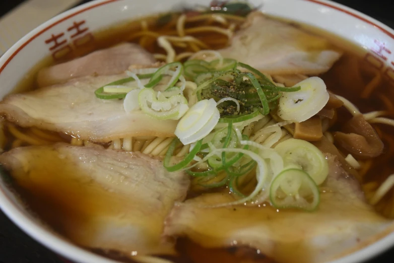 a bowl of soup sitting on top of a table, a picture, sōsaku hanga, fishbones, thumbnail, noodles, shinjuku