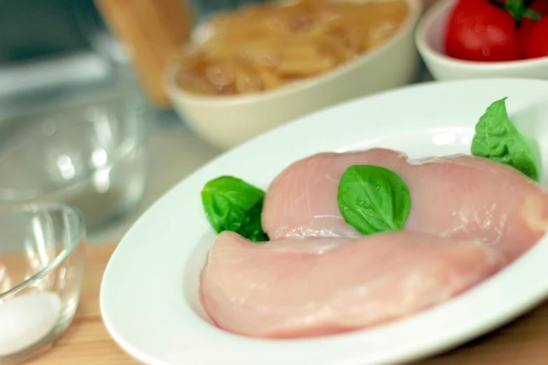 a close up of a plate of food on a table, filleting technique, realistic »